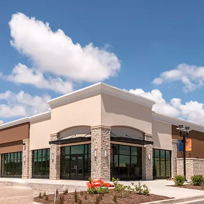 A large building with a sky background